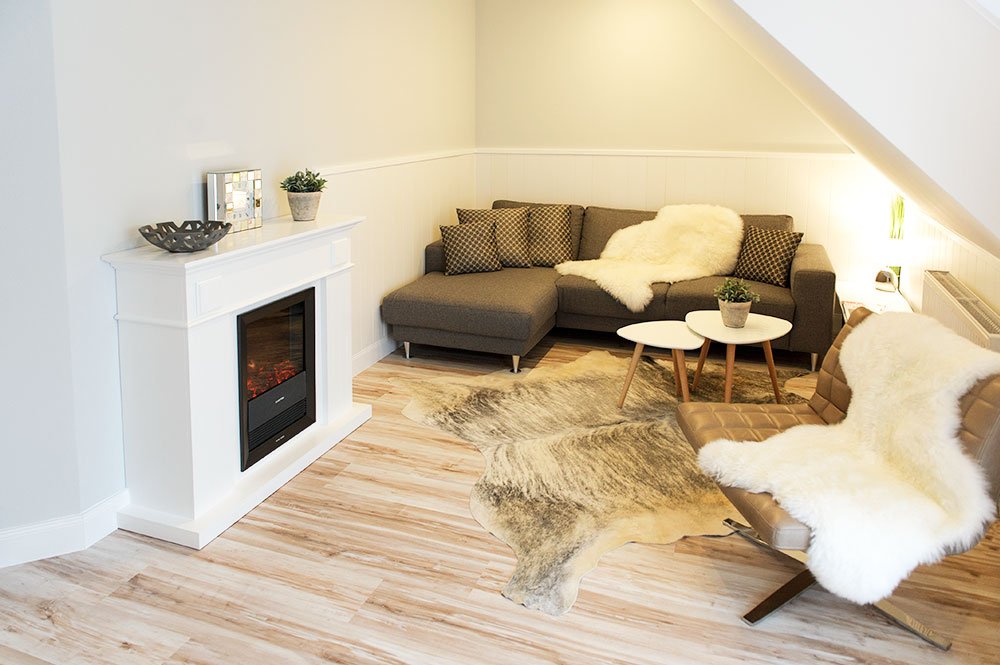 Wohnbereich mit Kamin - Grand Suite